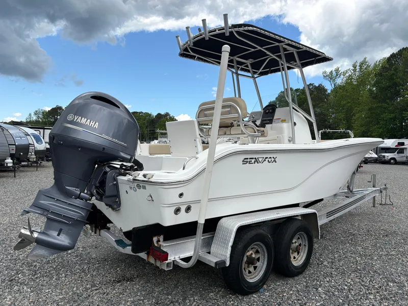 Slide: The Image of 2017 Sea Fox 206 Commander boat on trailer with Yamaha outboard motor, parked outdoors. - 5