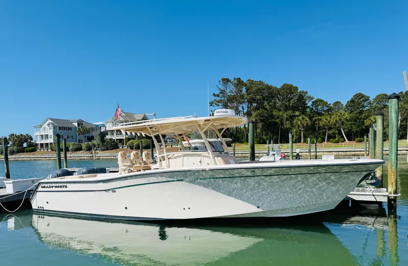 The Image of 2015 Grady-White 336 Canyon boat docked in a serene marina setting. - 0