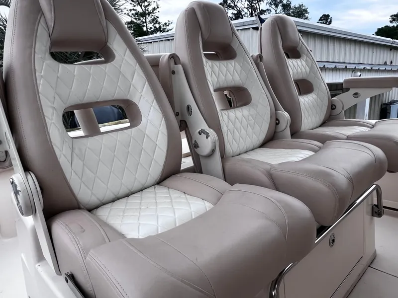 Slide: The Image of Luxurious seating on a 2015 Grady-White 336 Canyon boat with quilted upholstery. - 29