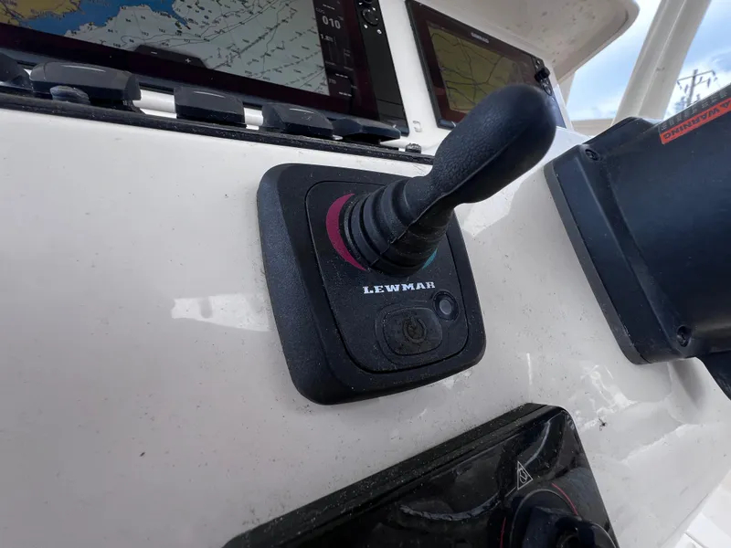 Slide: The Image of Joystick control on 2015 Grady-White 336 Canyon boat dashboard. - 32