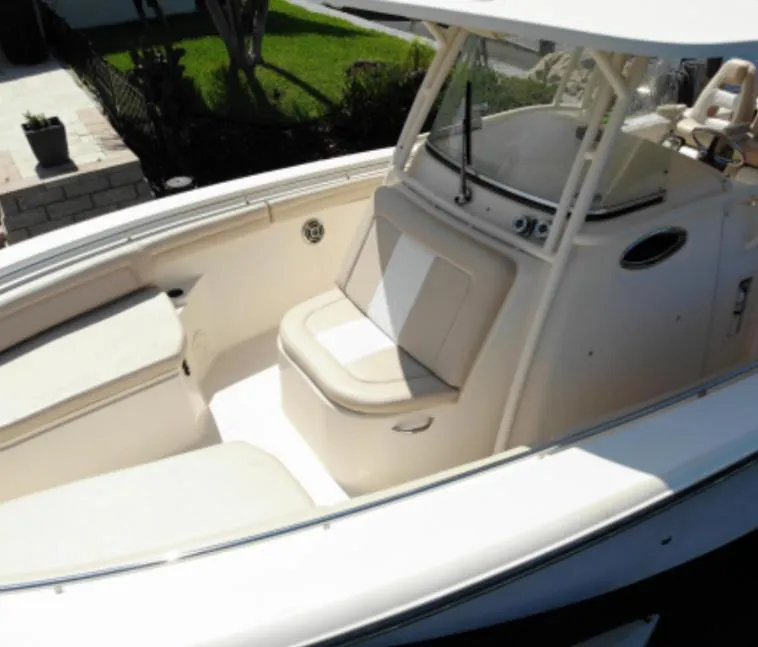 Slide: The Image of 2015 Grady-White 336 Canyon boat interior with seating and console. - 7