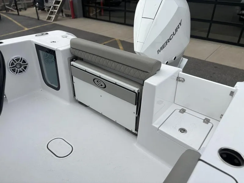 Slide: The Image of 2025 Sportsman Open 232 boat interior with seating and Mercury engine. - 12