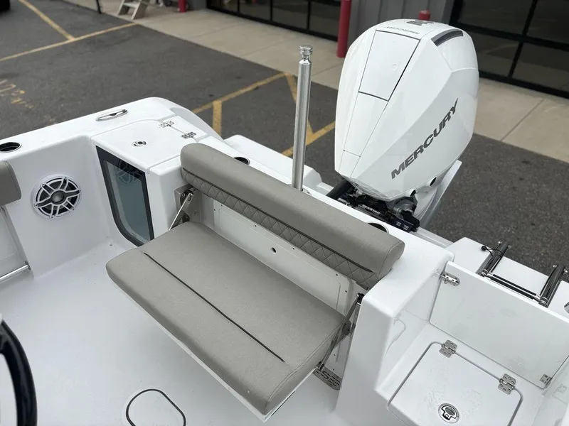 Slide: The Image of 2025 Sportsman Open 232 boat with Mercury engine and foldable seating. - 14