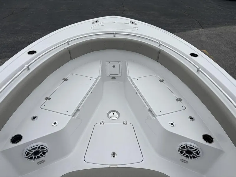 Slide: The Image of 2025 Sportsman Open 232 boat deck with storage compartments and speakers. - 17