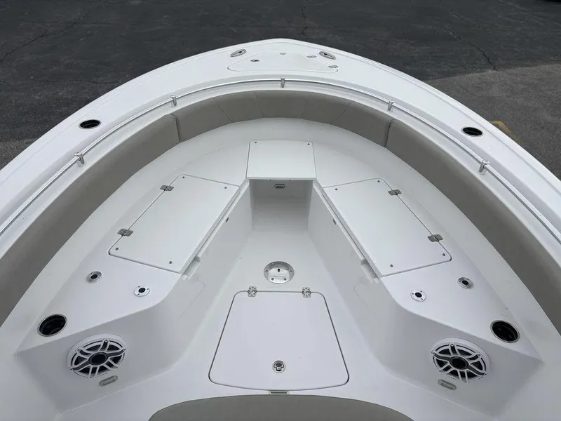 Slide: The Image of 2025 Sportsman Open 232 boat interior, featuring spacious seating and storage compartments. - 18