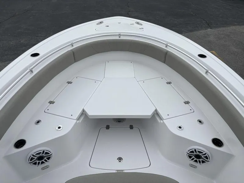 Slide: The Image of 2025 Sportsman Open 232 boat deck with seating and storage compartments. - 21