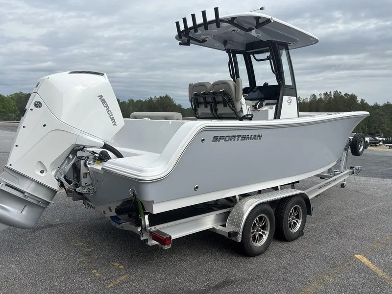 Slide: The Image of 2025 Sportsman Open 232 boat on trailer, featuring a Mercury outboard motor. - 23
