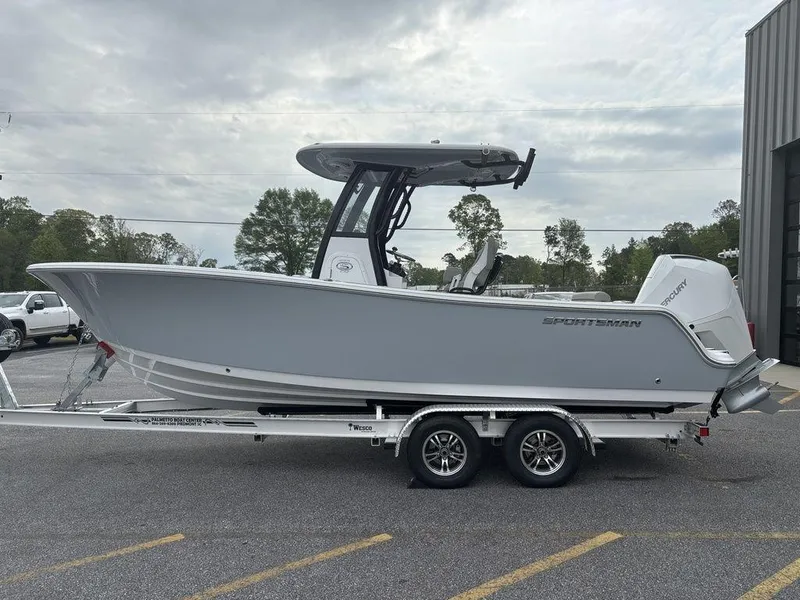 Slide: The Image of 2025 Sportsman Open 232 boat on trailer, parked outdoors, side view. - 5