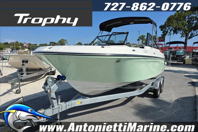 Slide: The Image of 2025 Trophy T22 SC boat on trailer with outboard motor, displayed at Antonietti Marine. - 1