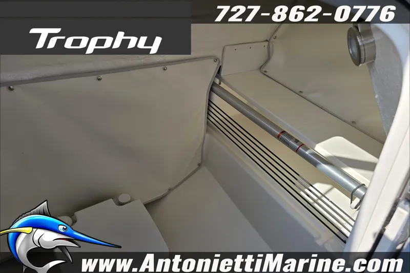 Slide: The Image of 2025 Trophy T22 SC boat detail with safety labels and contact information. - 36