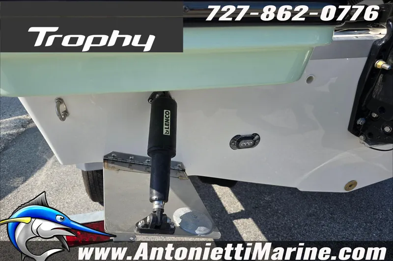 Slide: The Image of 2025 Trophy T22 SC boat on trailer, featuring rear ladder and contact details. - 37