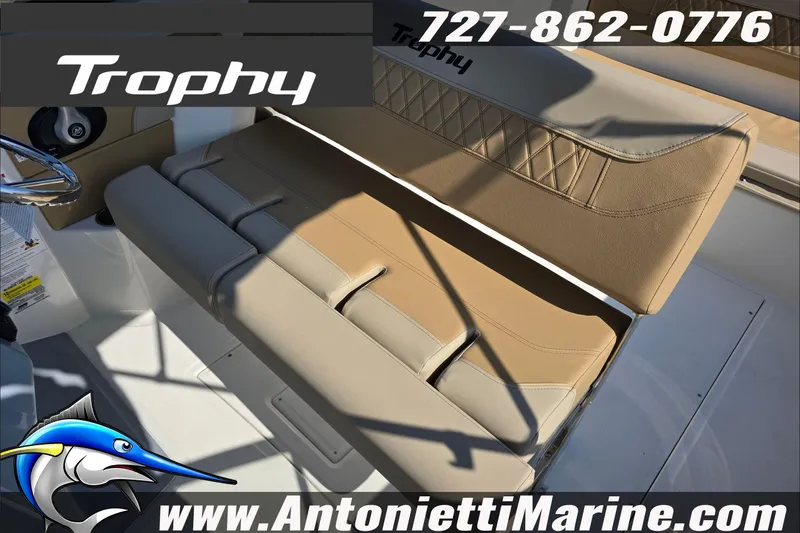 Slide: The Image of 2025 Trophy T22 SC boat interior with tan seating and cup holders. - 57