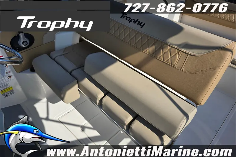 Slide: The Image of Interior view of 2025 Trophy T22 SC boat with tan seating and cup holders. - 58