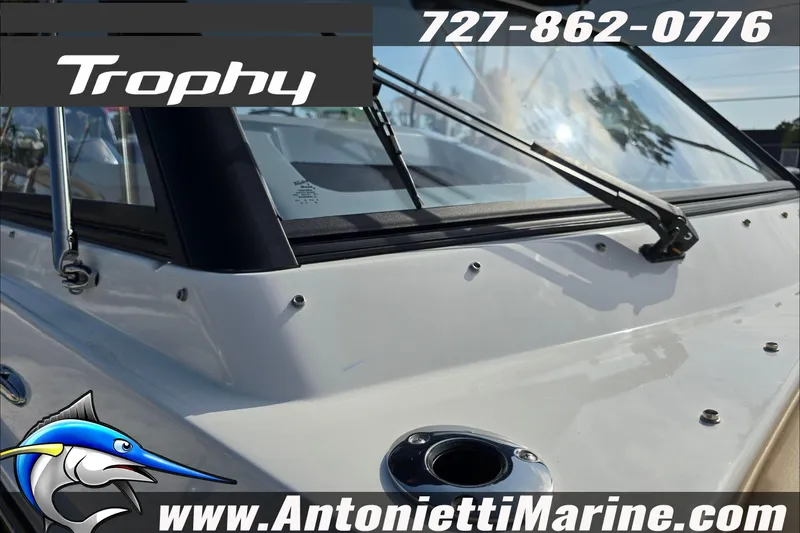 Slide: The Image of 2025 Trophy T22 SC boat interior with tan seating and cup holders. - 81