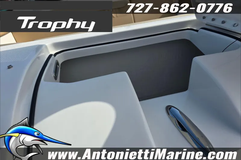 Slide: The Image of 2025 Trophy T22 SC boat storage compartment with open hatch, featuring sleek design and functionality. - 84