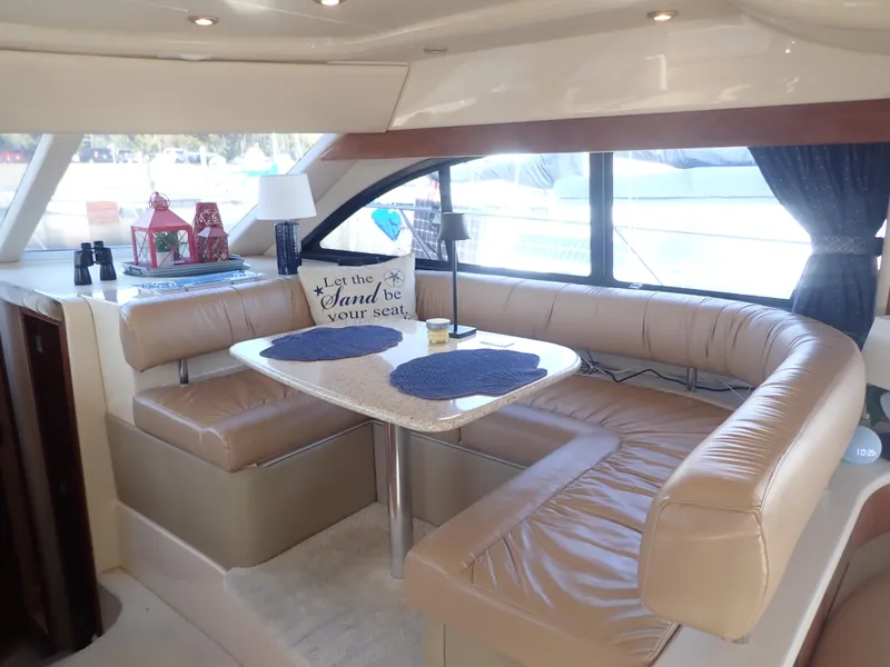 Slide: The Image of Luxurious interior of 2006 Meridian 411 Sedan yacht with leather seating and dining area. - 13