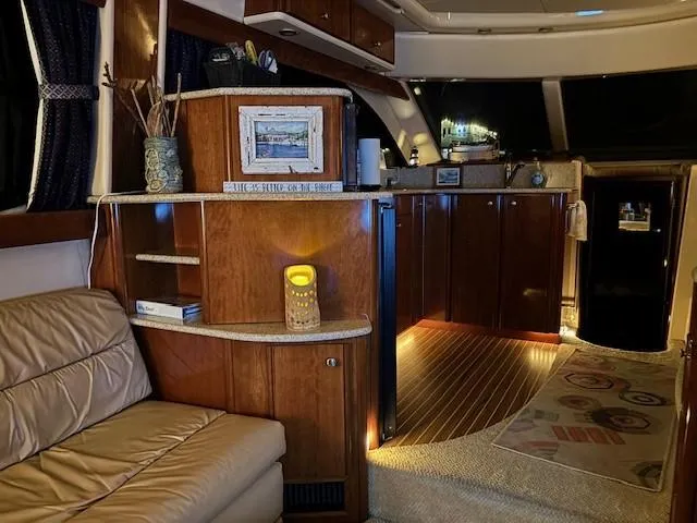 Slide: The Image of Luxurious interior of a 2006 Meridian 411 Sedan yacht with elegant wood finishes. - 19