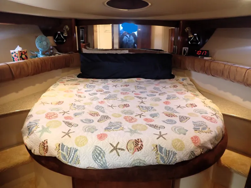 Slide: The Image of Cozy bedroom in 2006 Meridian 411 Sedan yacht with seashell-themed bedding. - 21