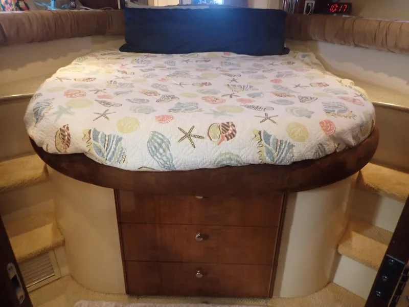 Slide: The Image of Cozy bedroom in 2006 Meridian 411 Sedan yacht with seashell-patterned bedding. - 22