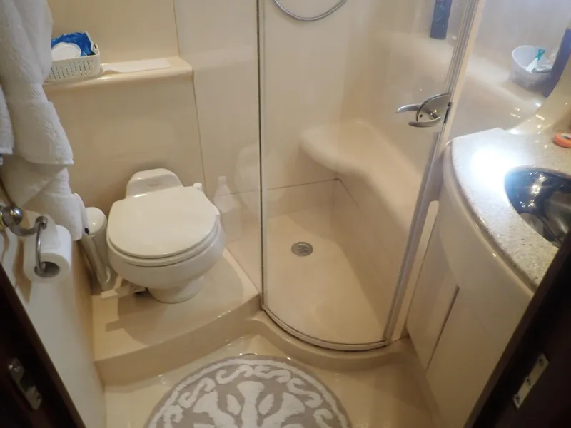 Slide: The Image of 2006 Meridian 411 Sedan bathroom with shower, toilet, and sink. - 24
