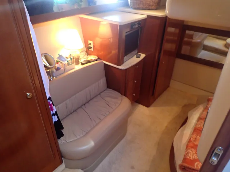 Slide: The Image of Interior of 2006 Meridian 411 Sedan yacht with cozy seating and wooden cabinetry. - 26