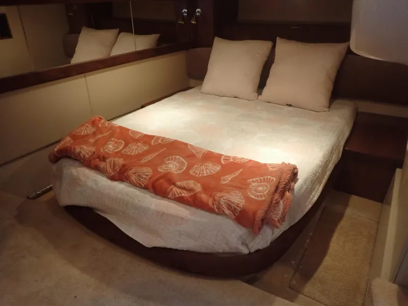 Slide: The Image of Luxurious bedroom interior of 2006 Meridian 411 Sedan yacht with cozy bedding. - 29