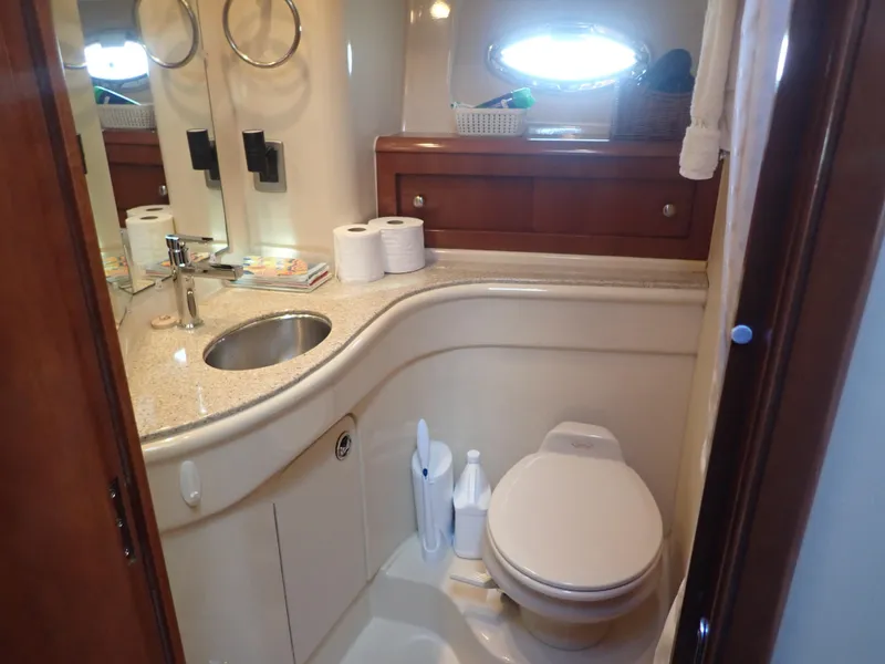 Slide: The Image of Luxurious bathroom in 2006 Meridian 411 Sedan yacht with modern fixtures and elegant design. - 30