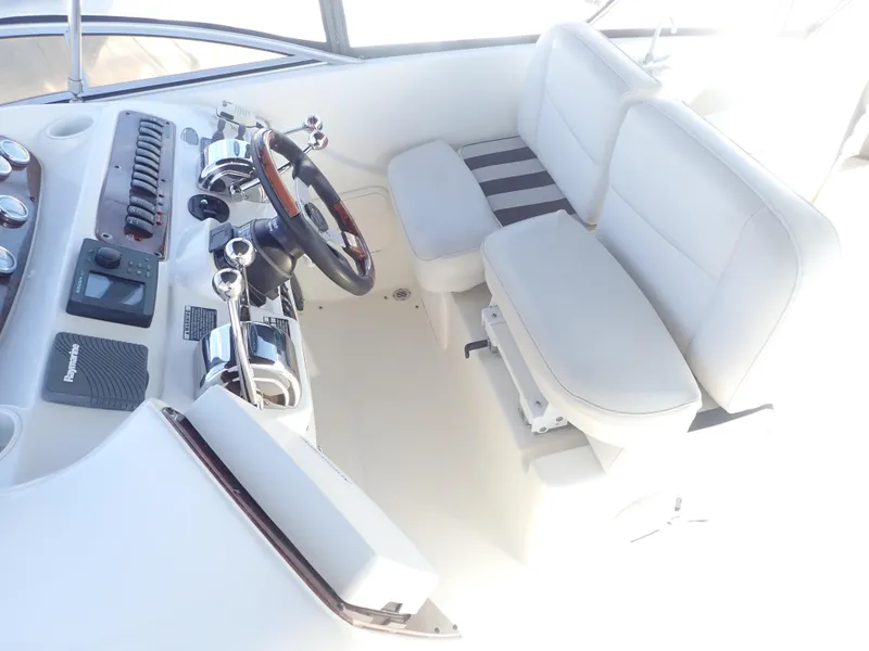 Slide: The Image of 2006 Meridian 411 Sedan helm with white seating and control panel. - 33