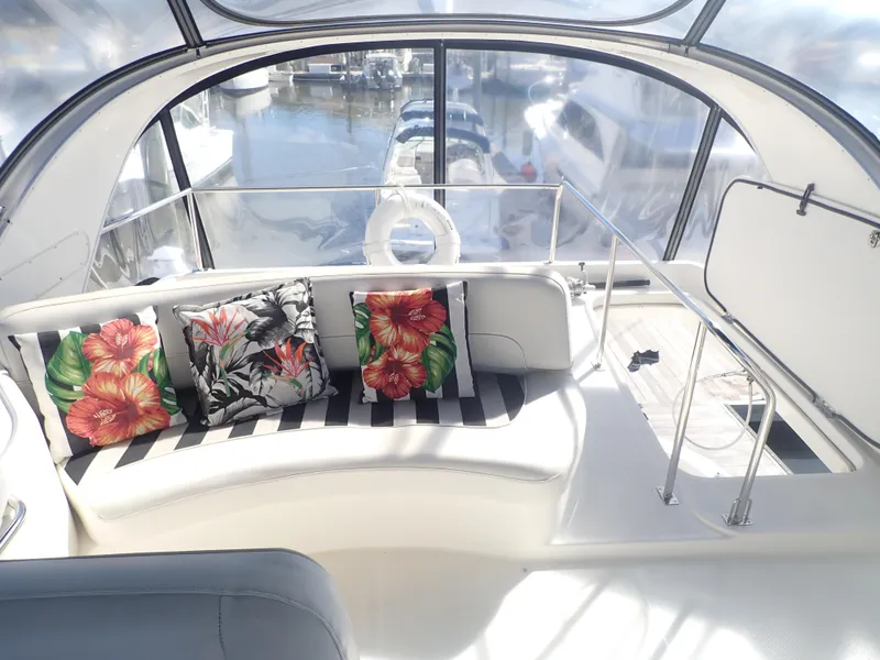Slide: The Image of Interior of 2006 Meridian 411 Sedan with floral cushions and marina view. - 34