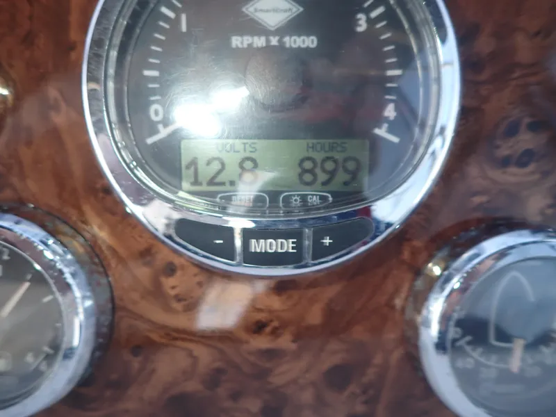 Slide: The Image of Close-up of 2006 Meridian 411 Sedan dashboard gauge displaying RPM, volts, and hours. - 36