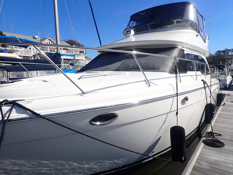 Slide: The Image of 2006 Meridian 411 Sedan yacht docked at marina under clear blue sky. - 40