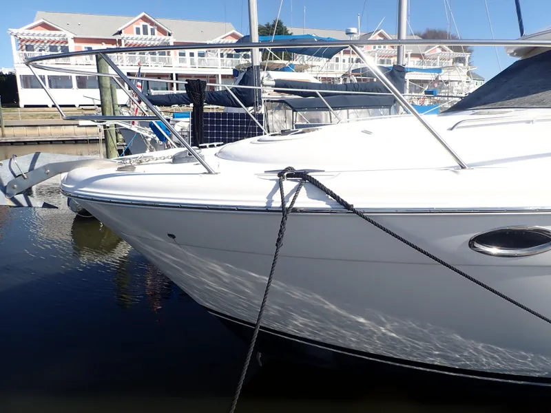 Slide: The Image of 2006 Meridian 411 Sedan yacht docked at marina, showcasing sleek white hull and railings. - 41