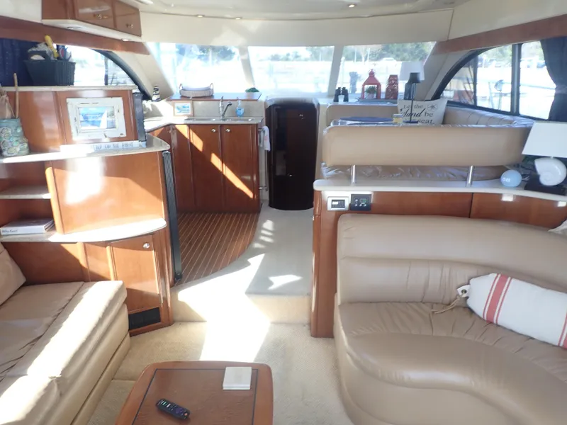 Slide: The Image of Luxurious interior of a 2006 Meridian 411 Sedan yacht with leather seating and wood finishes. - 7