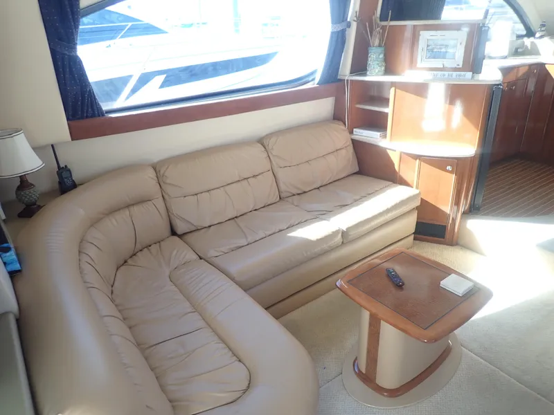 Slide: The Image of Luxurious interior of 2006 Meridian 411 Sedan yacht with beige leather seating. - 8