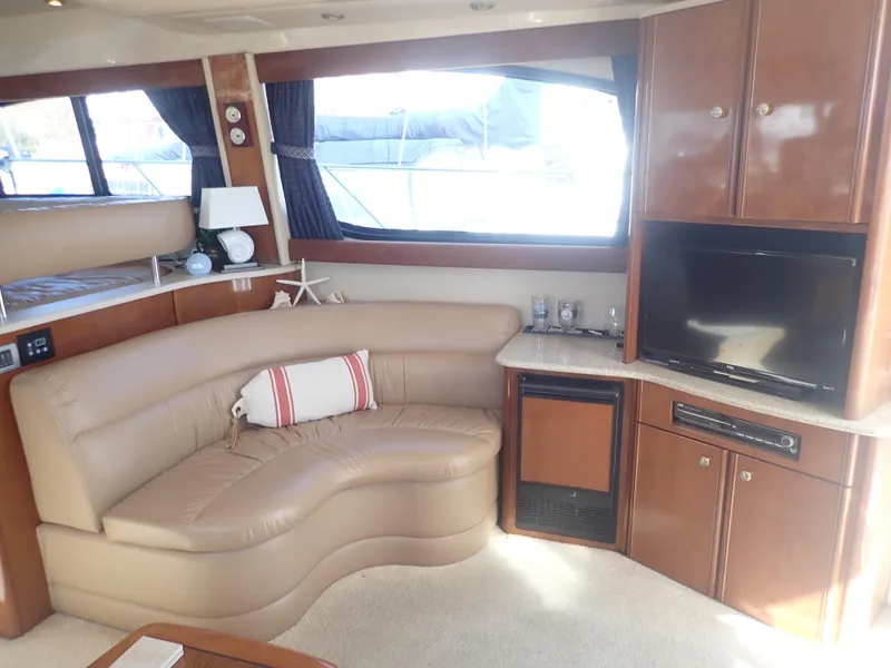 Slide: The Image of Luxurious interior of 2006 Meridian 411 Sedan yacht with leather seating and entertainment center. - 9