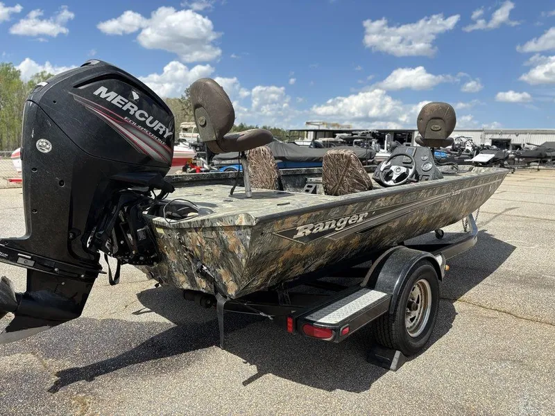 Slide: The Image of 2015 Ranger RC188 boat with Mercury engine on trailer under blue sky. - 16