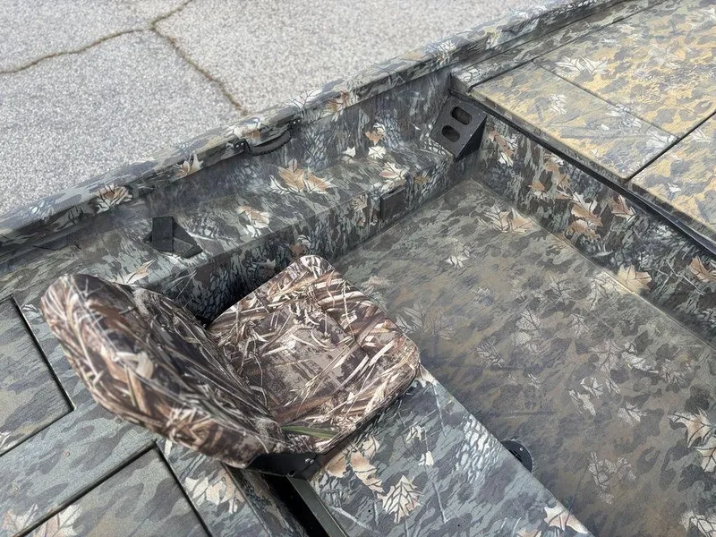 Slide: The Image of Camouflage interior of a 2015 Ranger RC188 boat with patterned seating and flooring. - 3