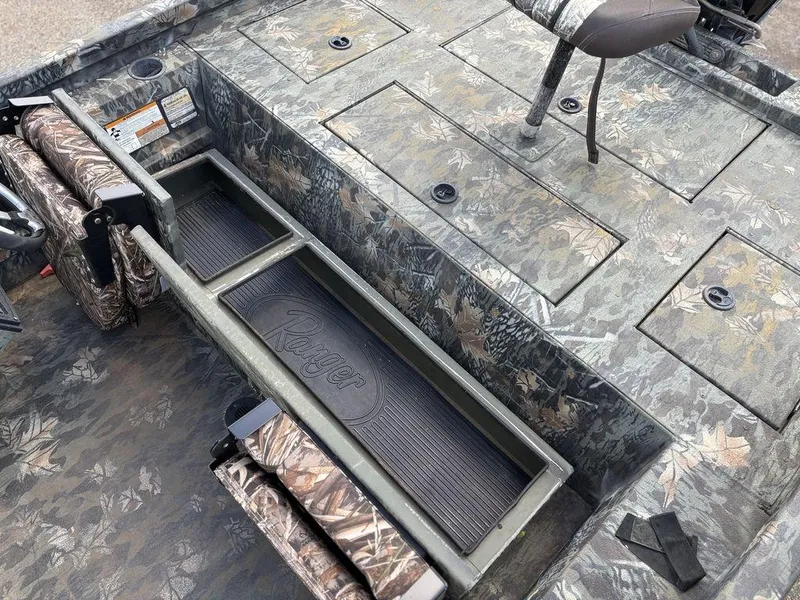 Slide: The Image of 2015 Ranger RC188 boat interior with camouflage design and storage compartments. - 4