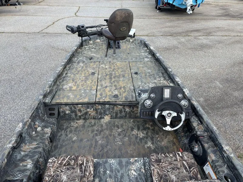 Slide: The Image of 2015 Ranger RC188 boat interior with camouflage design and steering console. - 6