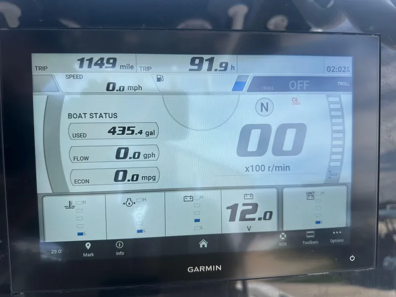 Slide: The Image of Garmin display on 2023 Sportsman Masters 247OE Bay Boat showing trip data and boat status. - 12