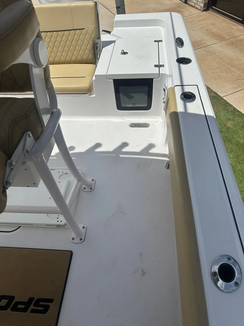 Slide: The Image of 2023 Sportsman Masters 247OE Bay Boat interior with seating and storage compartments. - 18