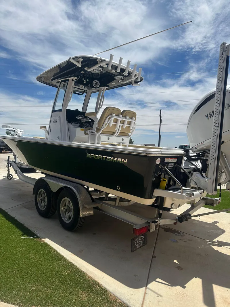 Slide: The Image of 2023 Sportsman Masters 247OE Bay Boat on trailer, parked outdoors under a blue sky. - 3