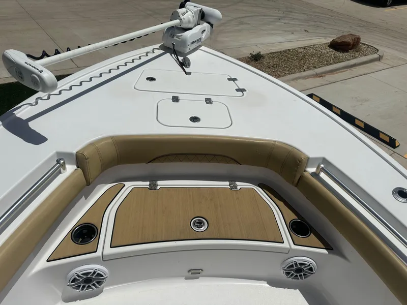 Slide: The Image of 2023 Sportsman Masters 247OE Bay Boat bow with seating, storage, and speakers. - 7
