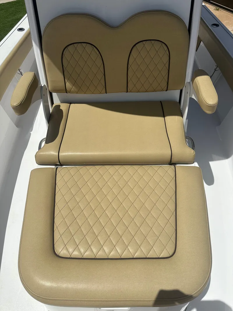 Slide: The Image of 2023 Sportsman Masters 247OE Bay Boat seat with tan diamond-stitched upholstery. - 9