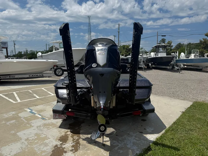 Slide: The Image of 2023 Skeeter ZXR 20 boat parked outdoors under a partly cloudy sky. - 10