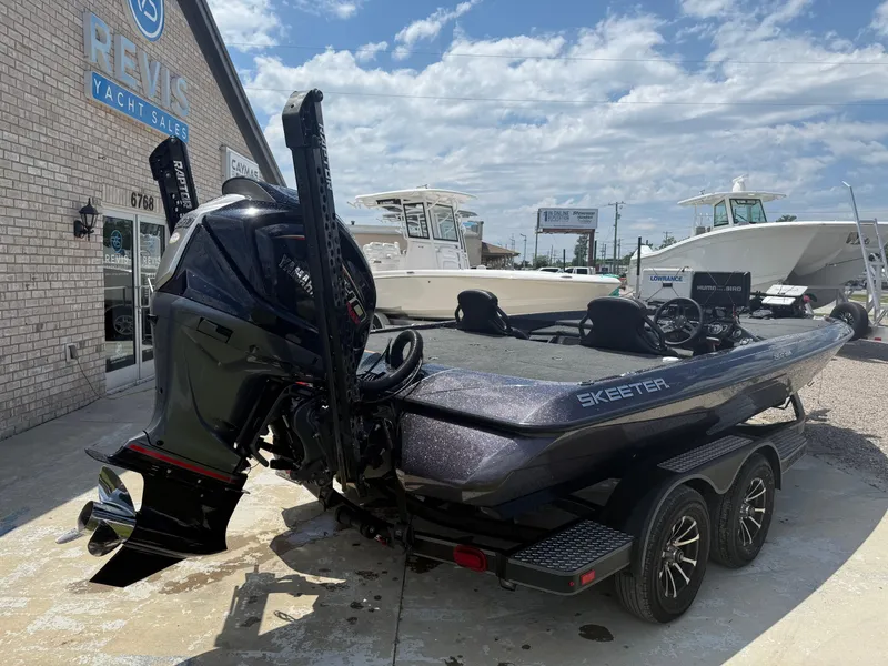 Slide: The Image of 2023 Skeeter ZXR 20 boat on trailer at dealership, rear view. - 11
