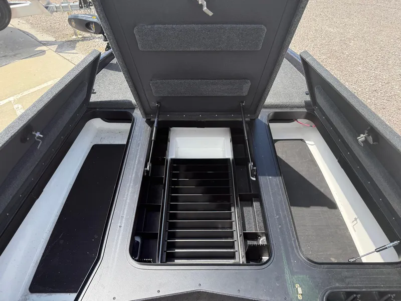 Slide: The Image of 2023 Skeeter ZXR 20 boat storage compartments with open lid and organized interior. - 14