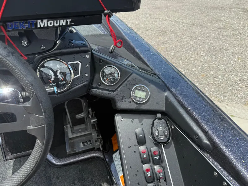 Slide: The Image of 2023 Skeeter ZXR 20 boat dashboard with gauges and controls. - 23