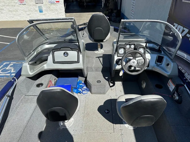 Slide: The Image of 2019 Tracker Pro Guide V-175 Combo boat interior with seating and steering console. - 10