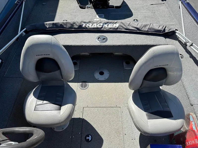 Slide: The Image of 2019 Tracker Pro Guide V-175 Combo boat interior with two gray seats. - 12